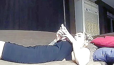 Sexy young chick masturbates with a dildo